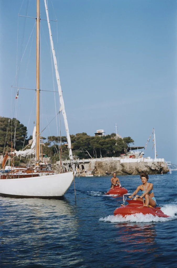 A man and a woman on jet skis off the coast of Monte Carlo, Monaco, 1956. 